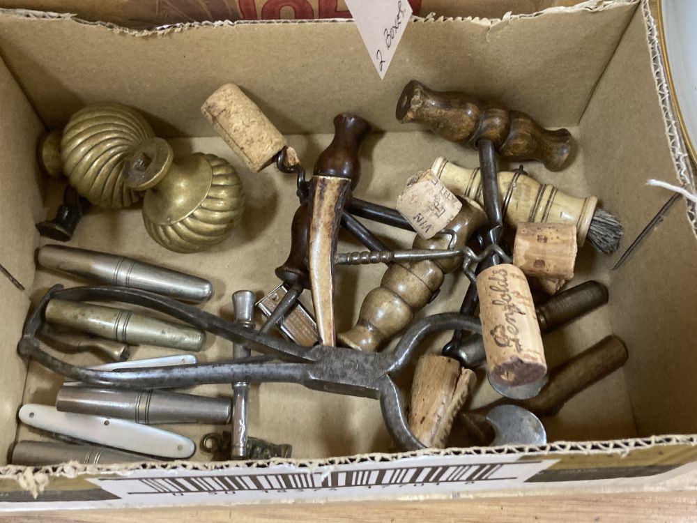 A group of cork screws, pen knives and pipe tampers